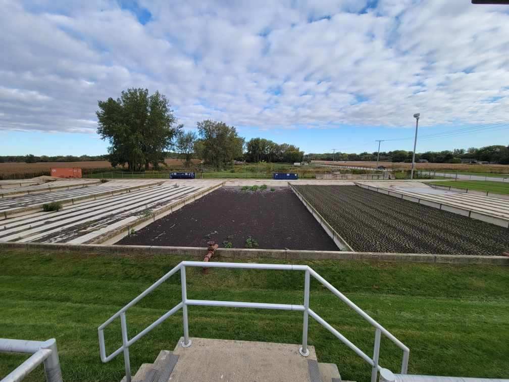 A sand/ sludge drying bed at a wastewater treatment plant